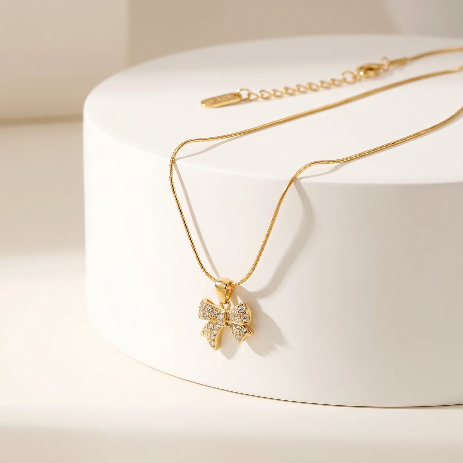 Pave Crystal Bow Pendant Snake Chain Necklace – 18K PVD Gold Plated
